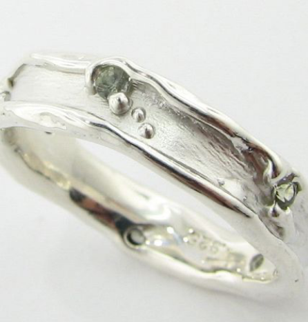 silver ring small green stones